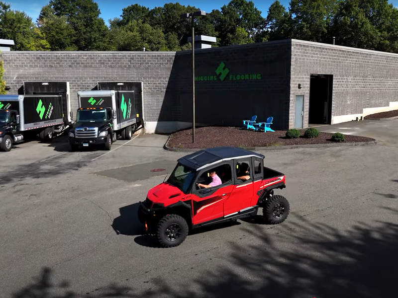 Higgins team driving a Polaris CPU from Ardex outside the showroom