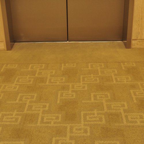 Conference space with yellow carpet floors